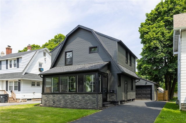 74 Everett St, Greece, NY 14615 - colonial inspired home with an outdoor structure, a garage, a shingled roof, a front yard, and a gambrel roof