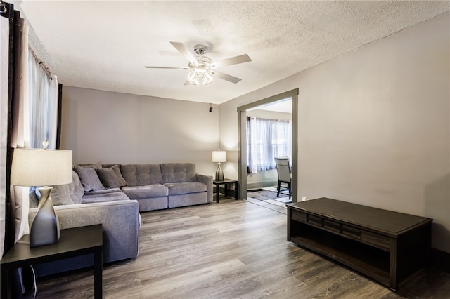 74 Everett St, Greece, NY 14615 - living room featuring a ceiling fan, wood finished floors, and a textured ceiling