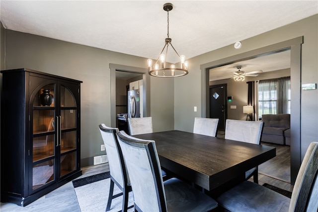 74 Everett St, Greece, NY 14615 - dining room with light wood-type flooring and a chandelier