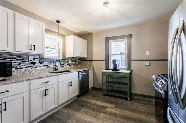 74 Everett St, Greece, NY 14615 - kitchen with a sink, stainless steel appliances, healthy amount of natural light, and backsplash