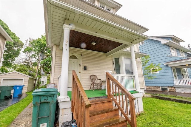 127 Devonshire Ct, Rochester, NY 14619 - entrance to property featuring covered porch, a lawn, and a garage