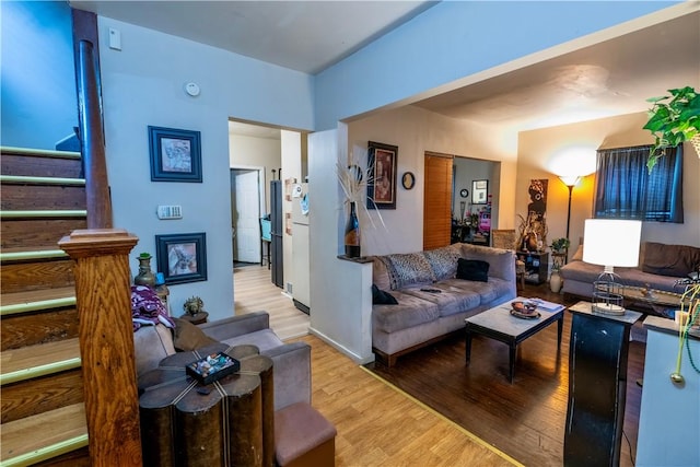 127 Devonshire Ct, Rochester, NY 14619 - living area with light wood-style flooring and stairway