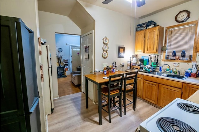 127 Devonshire Ct, Rochester, NY 14619 - kitchen featuring light wood-style floors, white appliances, a sink, light countertops, and a ceiling fan