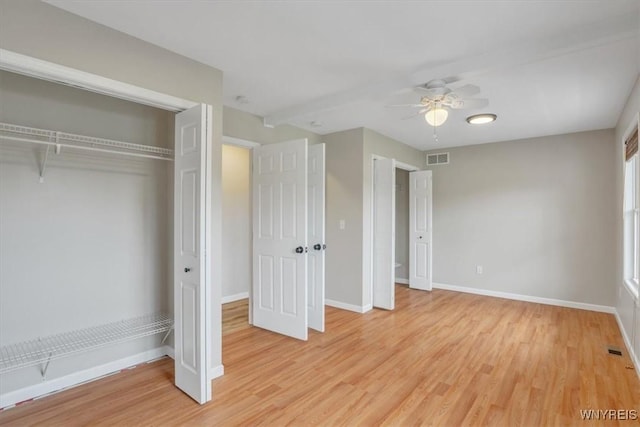 836 Upper Mountain Rd, Lewiston, NY 14092 - unfurnished bedroom featuring baseboards, light wood-style floors, ceiling fan, and a closet