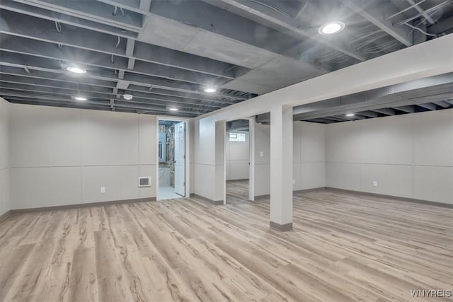836 Upper Mountain Rd, Lewiston, NY 14092 - basement with wood finished floors and baseboards