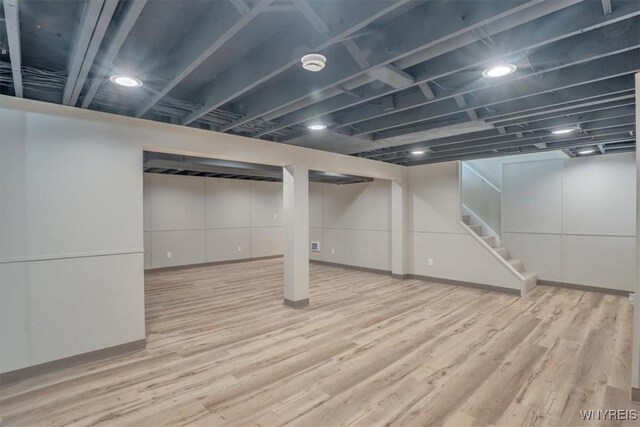 836 Upper Mountain Rd, Lewiston, NY 14092 - finished below grade area with wood finished floors, stairs, and baseboards