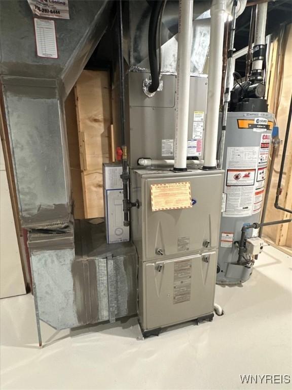 836 Upper Mountain Rd, Lewiston, NY 14092 - utility room with water heater