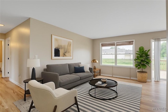 836 Upper Mountain Rd, Lewiston, NY 14092 - living area with baseboards and light wood-style flooring