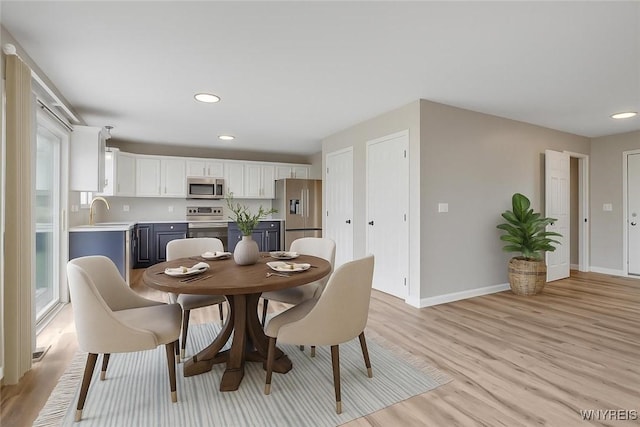 836 Upper Mountain Rd, Lewiston, NY 14092 - dining space with light wood-style floors, baseboards, and recessed lighting