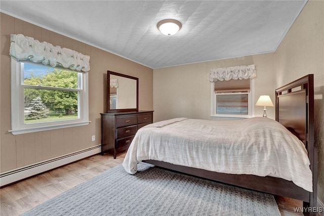 2194 Rte 39, Sheridan, NY 14062 - bedroom featuring wood finished floors, ornamental molding, and baseboard heating