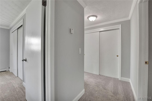 2194 Rte 39, Sheridan, NY 14062 - hall with carpet, a baseboard heating unit, a textured ceiling, baseboards, and ornamental molding