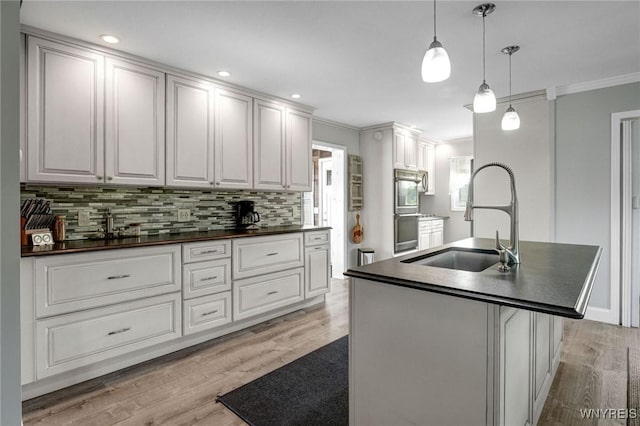 2194 Rte 39, Sheridan, NY 14062 - kitchen with dark countertops, ornamental molding, a sink, light wood-style floors, and backsplash