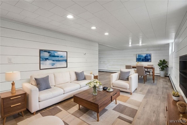 2194 Rte 39, Sheridan, NY 14062 - living area with a baseboard radiator, recessed lighting, light wood-style flooring, a baseboard heating unit, and wood walls