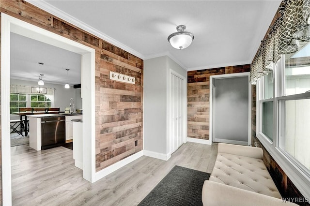 2194 Rte 39, Sheridan, NY 14062 - foyer with an accent wall, wooden walls, crown molding, light wood finished floors, and baseboards