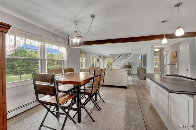 2194 Rte 39, Sheridan, NY 14062 - dining room featuring a baseboard radiator, crown molding, healthy amount of natural light, light wood-style flooring, and stairs