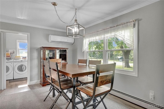 2194 Rte 39, Sheridan, NY 14062 - dining room with a wall mounted air conditioner, washing machine and dryer, baseboard heating, ornamental molding, and a chandelier