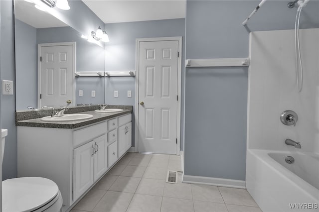 6017 Corinne Ln, Clarence, NY 14032 - bathroom featuring toilet, tile patterned floors, double vanity, tub / shower combination, and baseboards