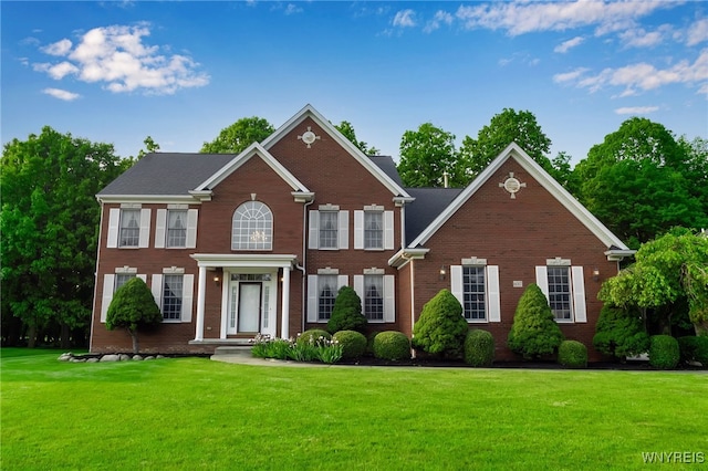 6017 Corinne Ln, Clarence, NY 14032 - view of front facade featuring a front lawn and brick siding