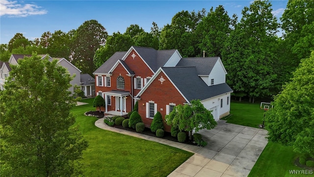 6017 Corinne Ln, Clarence, NY 14032 - view of front facade with driveway, a front yard, and brick siding