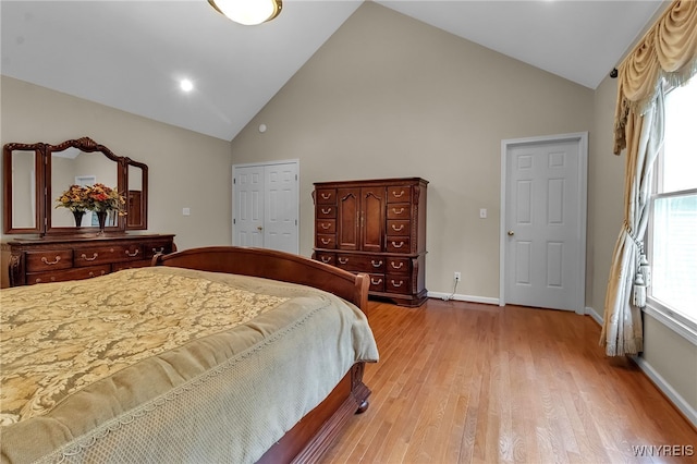 6017 Corinne Ln, Clarence, NY 14032 - bedroom with high vaulted ceiling, light wood-style floors, and baseboards