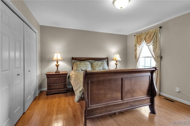 6017 Corinne Ln, Clarence, NY 14032 - bedroom featuring a closet, light wood-type flooring, and baseboards