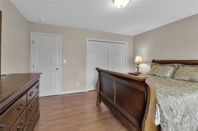 6017 Corinne Ln, Clarence, NY 14032 - bedroom featuring light wood-style flooring, a closet, and baseboards