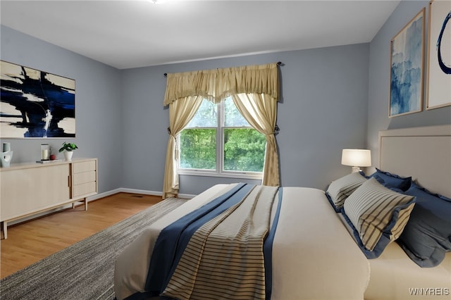 6017 Corinne Ln, Clarence, NY 14032 - bedroom with wood finished floors and baseboards
