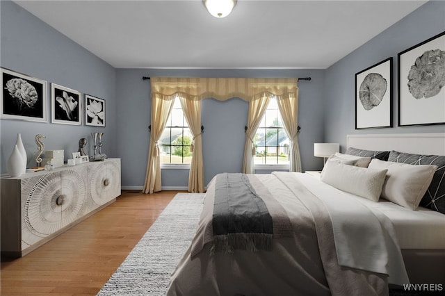 6017 Corinne Ln, Clarence, NY 14032 - bedroom with light wood-style floors and baseboards