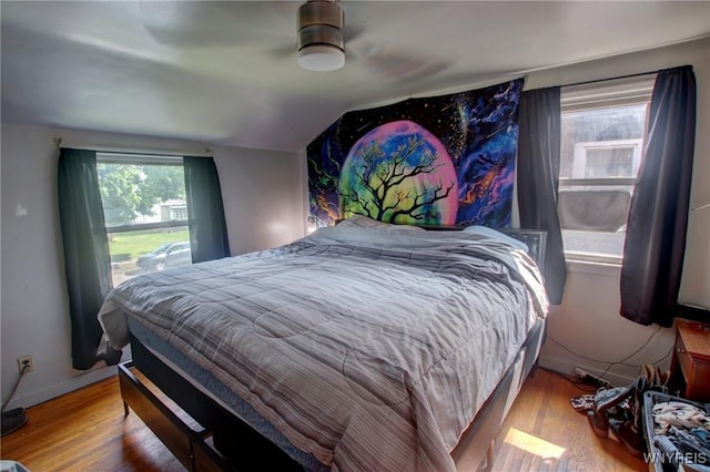 15 Arbour Ln, Buffalo, NY 14220 - bedroom featuring wood finished floors, vaulted ceiling, and baseboards