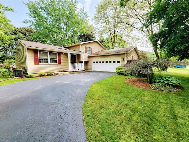 508 Countess Dr, Henrietta, NY 14586 - split level home with driveway, a garage, central AC unit, and a front lawn