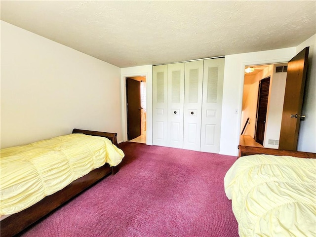 508 Countess Dr, Henrietta, NY 14586 - bedroom with carpet flooring, a closet, and a textured ceiling