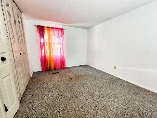 508 Countess Dr, Henrietta, NY 14586 - unfurnished bedroom featuring carpet, baseboards, a closet, and a textured ceiling