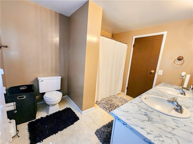 508 Countess Dr, Henrietta, NY 14586 - full bath featuring a shower with curtain, double vanity, toilet, and baseboards