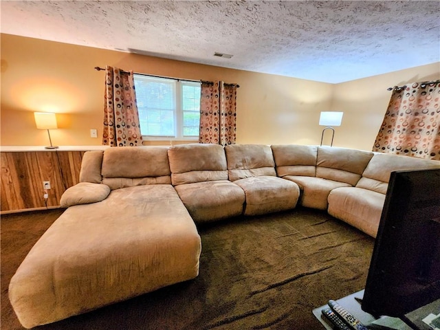 508 Countess Dr, Henrietta, NY 14586 - living area featuring carpet floors, a textured ceiling, wood walls, and wainscoting