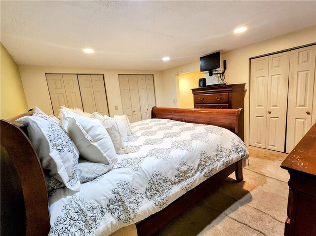 508 Countess Dr, Henrietta, NY 14586 - bedroom with two closets, light colored carpet, and recessed lighting