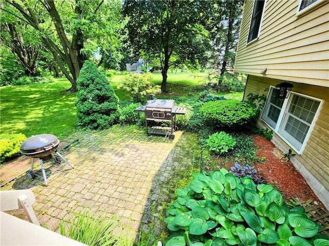 508 Countess Dr, Henrietta, NY 14586 - view of green lawn featuring a patio area and an outdoor fire pit