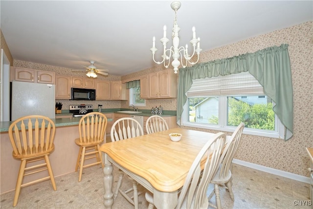 12 Sparrowbush Rd S, S, NY 12110 - dining room with wallpapered walls, a chandelier, a ceiling fan, and baseboards