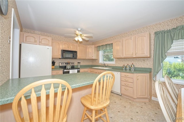 12 Sparrowbush Rd S, S, NY 12110 - kitchen featuring white appliances, light brown cabinets, a sink, a kitchen breakfast bar, and wallpapered walls