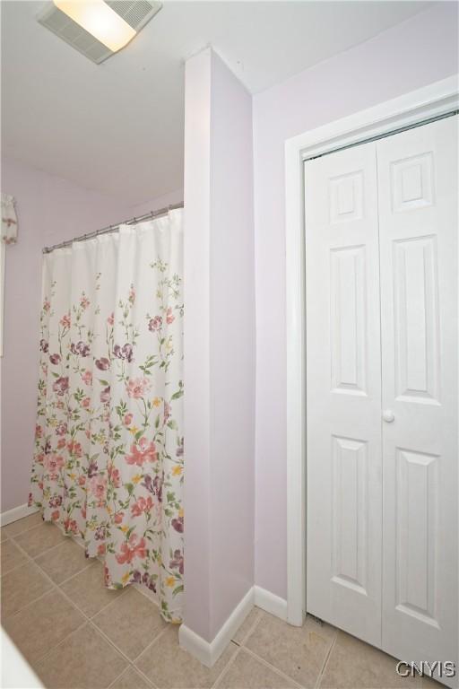 12 Sparrowbush Rd S, S, NY 12110 - bathroom with tile patterned flooring, baseboards, and curtained shower