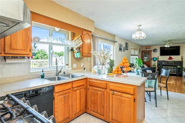 53 Toni Ter, Chili, NY 14624 - kitchen featuring a peninsula, healthy amount of natural light, and light countertops