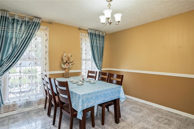 53 Toni Ter, Chili, NY 14624 - dining room featuring a chandelier and baseboards