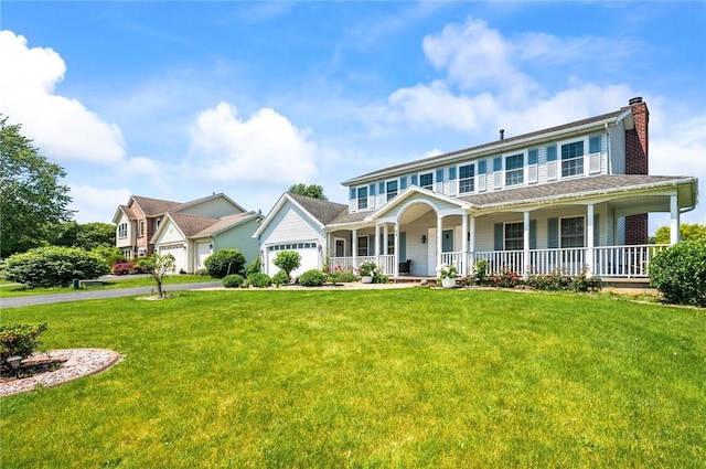53 Toni Ter, Chili, NY 14624 - view of front of home featuring covered porch, a chimney, a front lawn, driveway, and a garage