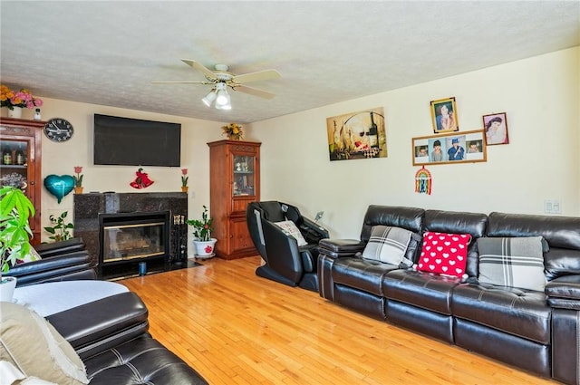 53 Toni Ter, Chili, NY 14624 - living area with a ceiling fan, wood finished floors, and a premium fireplace