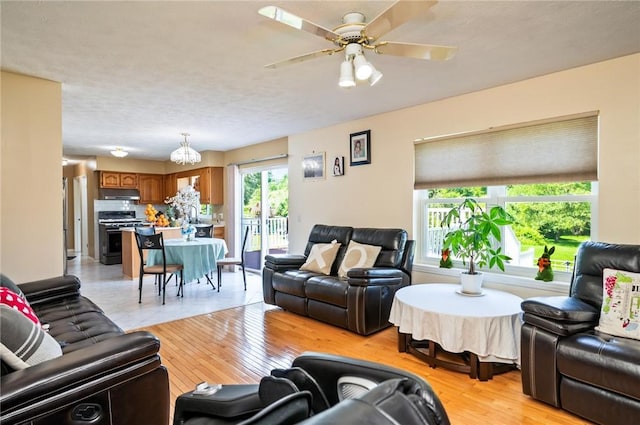 53 Toni Ter, Chili, NY 14624 - living area with ceiling fan and light wood-style flooring