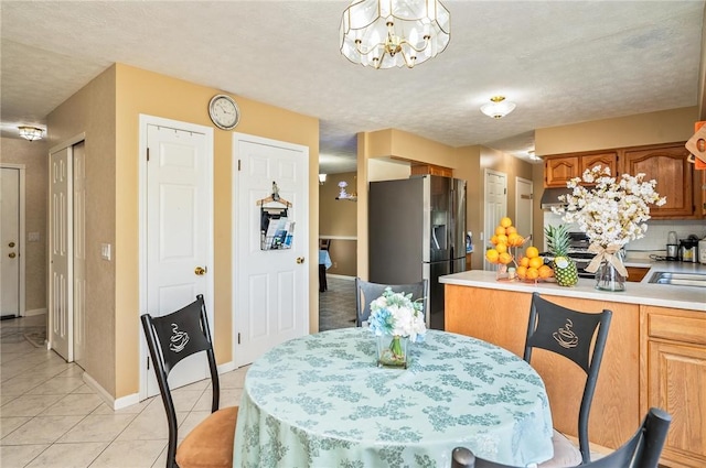 53 Toni Ter, Chili, NY 14624 - dining space with a chandelier and light tile patterned flooring