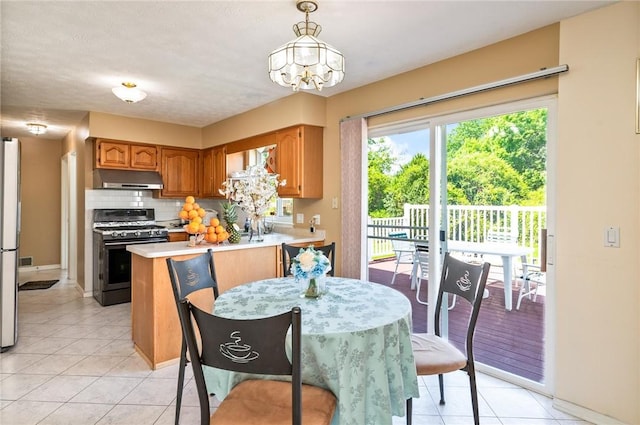 53 Toni Ter, Chili, NY 14624 - dining space with light tile patterned flooring and a chandelier
