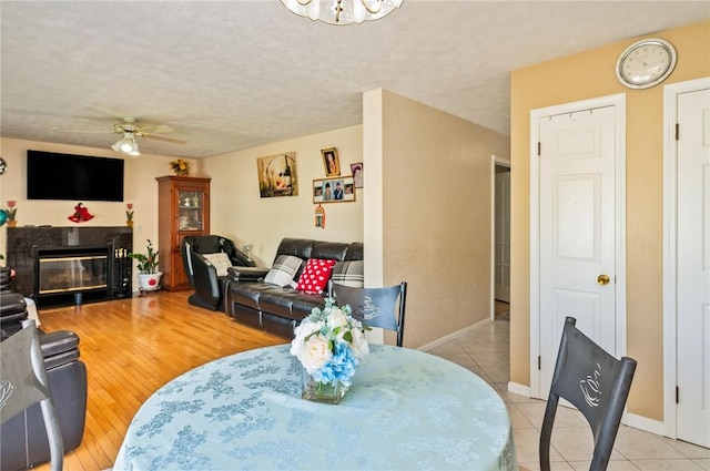 53 Toni Ter, Chili, NY 14624 - living area with ceiling fan, a fireplace, and light tile patterned flooring