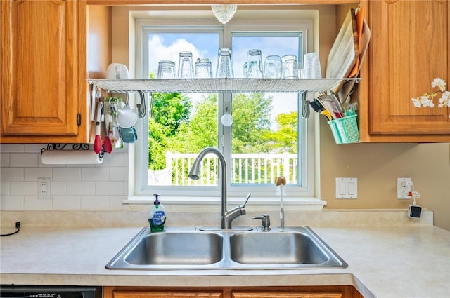 53 Toni Ter, Chili, NY 14624 - kitchen with light countertops, brown cabinets, and healthy amount of natural light
