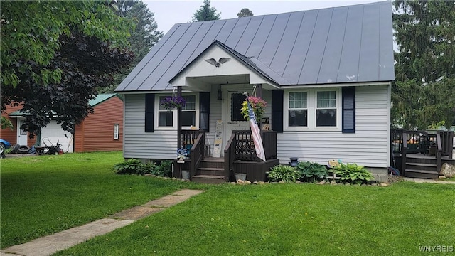 11 Parkview Ct, Arcade, NY 14009 - bungalow featuring a standing seam roof, a front lawn, metal roof, and a deck