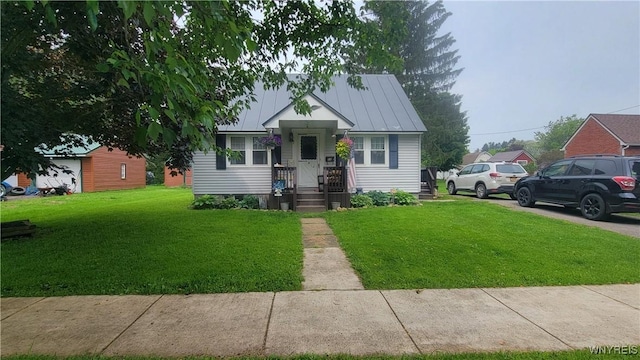 11 Parkview Ct, Arcade, NY 14009 - bungalow-style house featuring a standing seam roof, a front yard, and metal roof